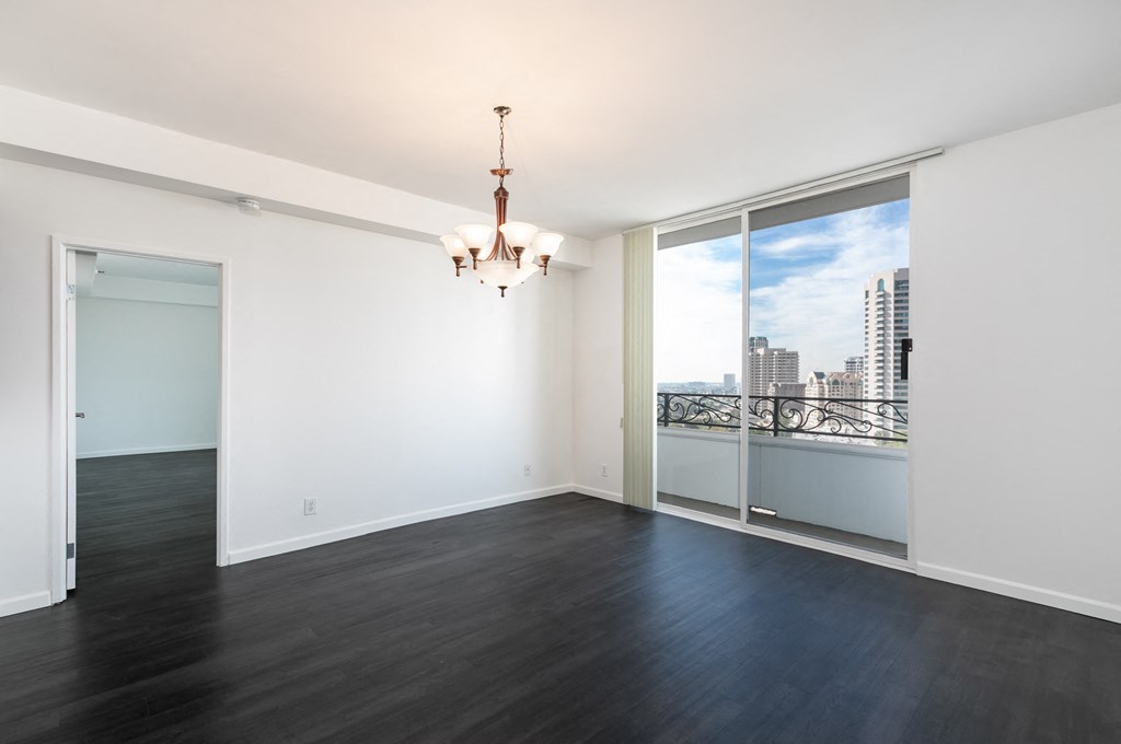Dining Room with Hardwood Floors, Chandelier and Patio Doors