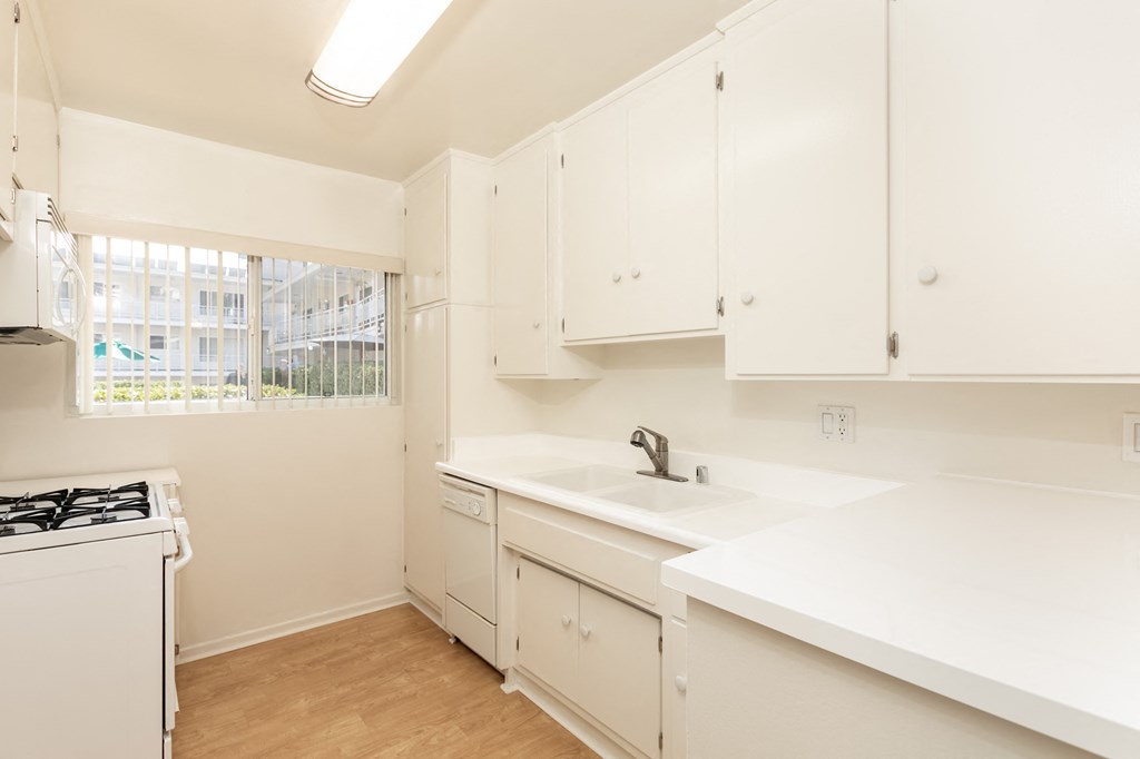 Kitchen with White Appliances and White Cabinets