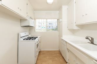 Kitchen with White Appliances and White Cabinets