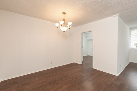 Dining Room with Hardwood Floors and Chandelier