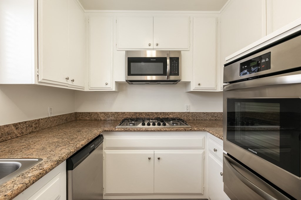 Kitchen with Stainless Steel Appliances and White Cabinets