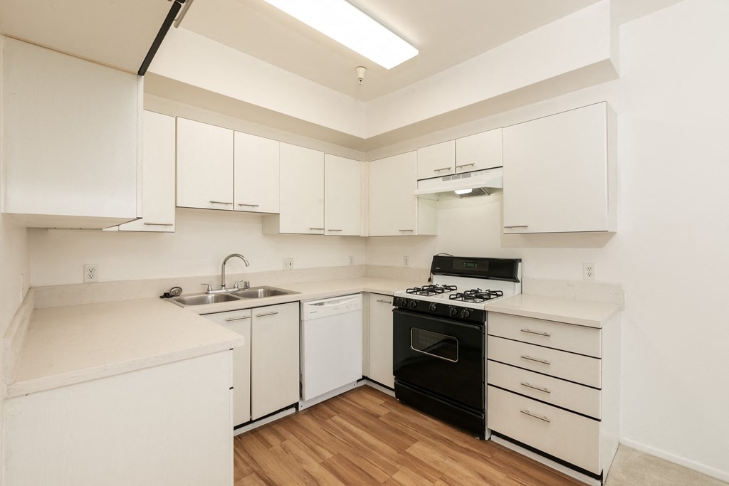 Kitchen with White Appliances and Hardwood Floors