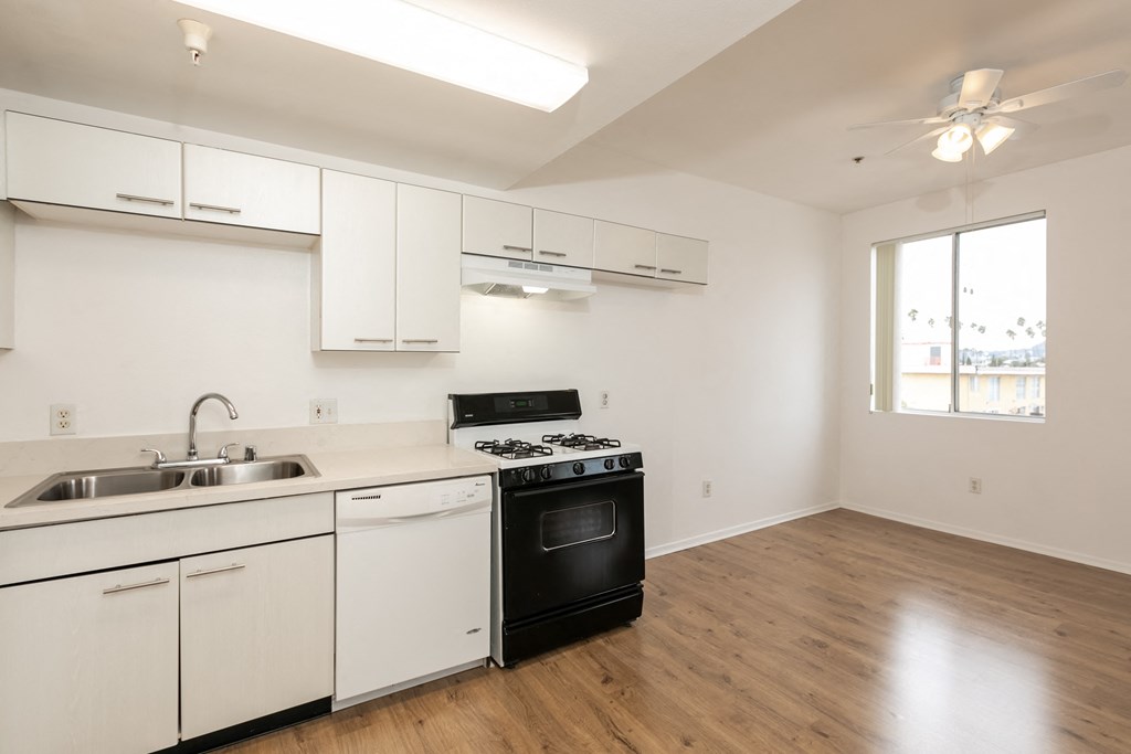 Kitchen with White Cabinets and Hardwood Floors