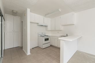 Kitchen with White Appliances and White Cabinets