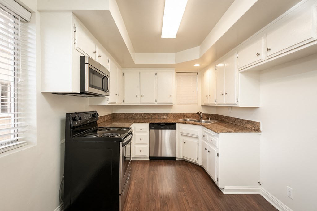 Kitchen with Stainless Steel Appliances and White Cabinets