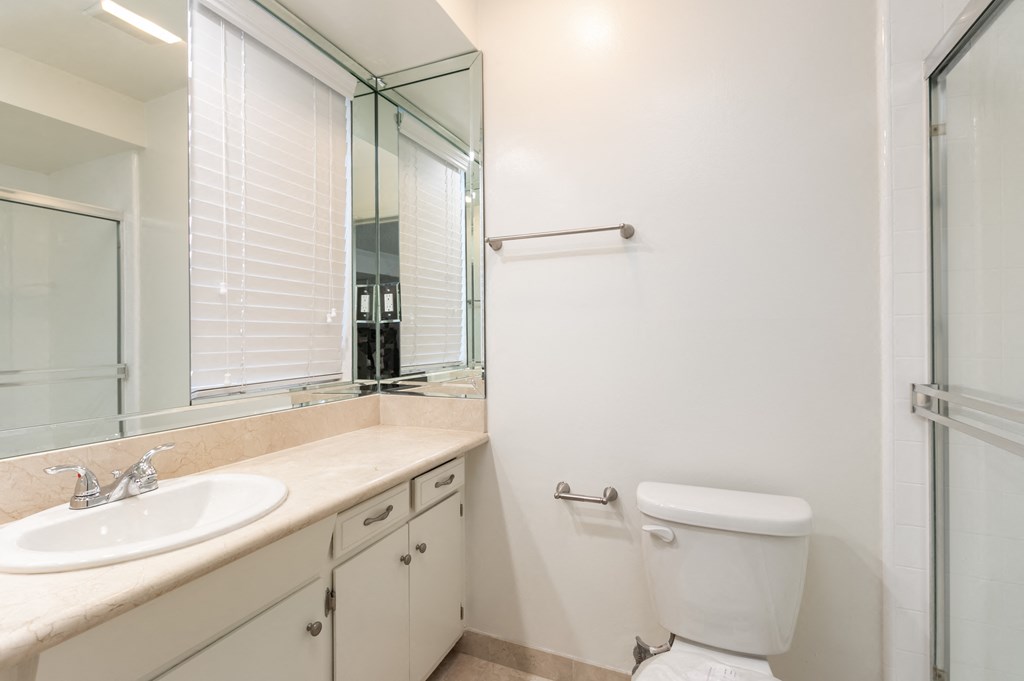Bathroom with White Cabinets and Shower