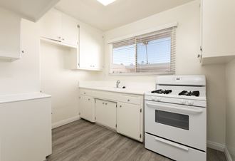 Kitchen with White Appliances and White Cabinets