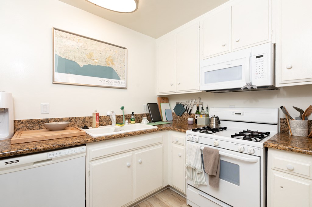 Kitchen with White Appliances and White Cabinets
