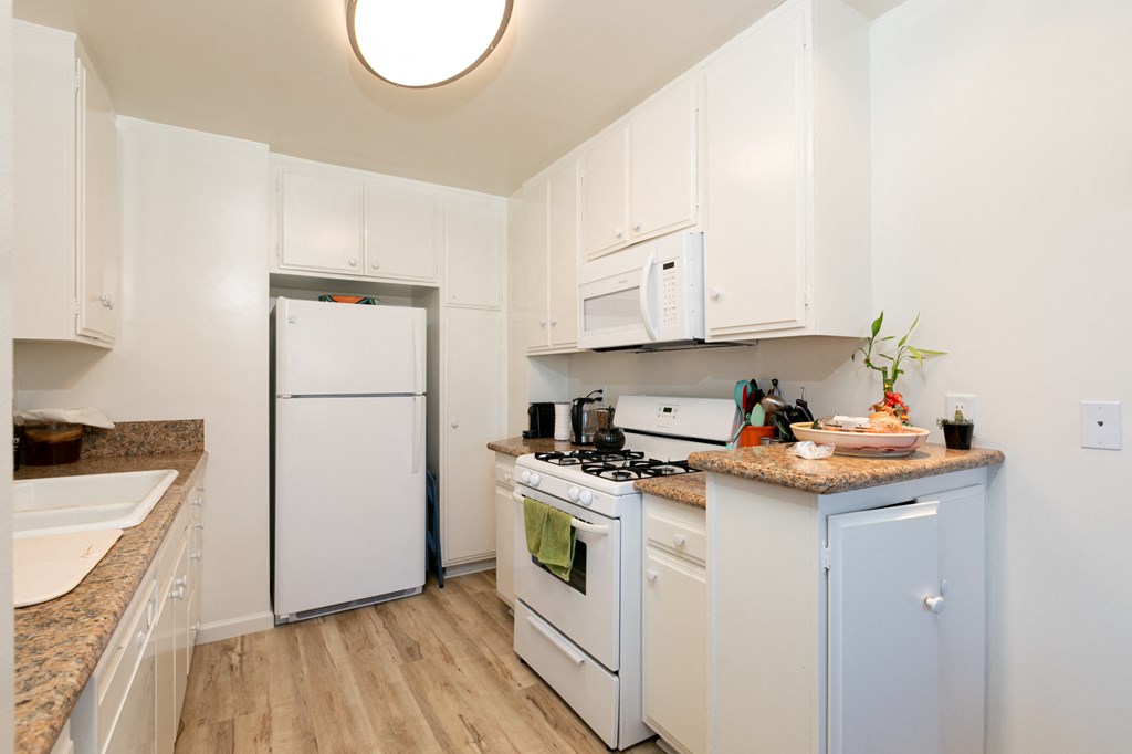 Kitchen with White Appliances and White Cabinets