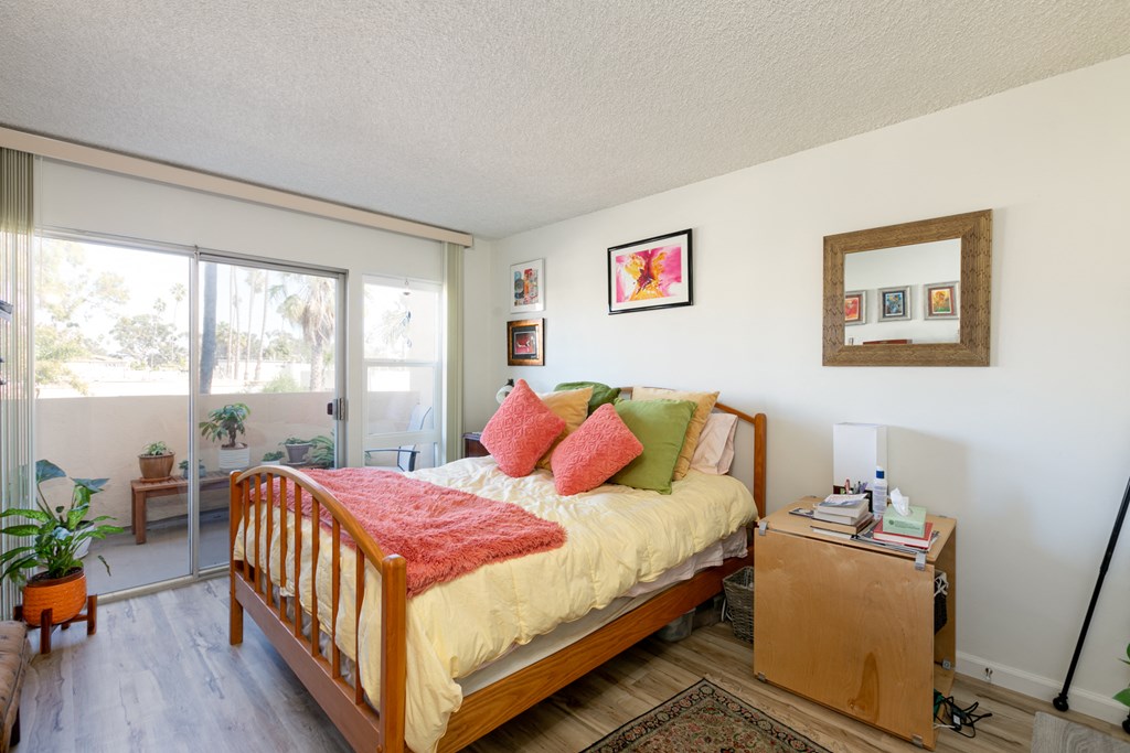Bedroom with Hardwood Floors and Patio Doors