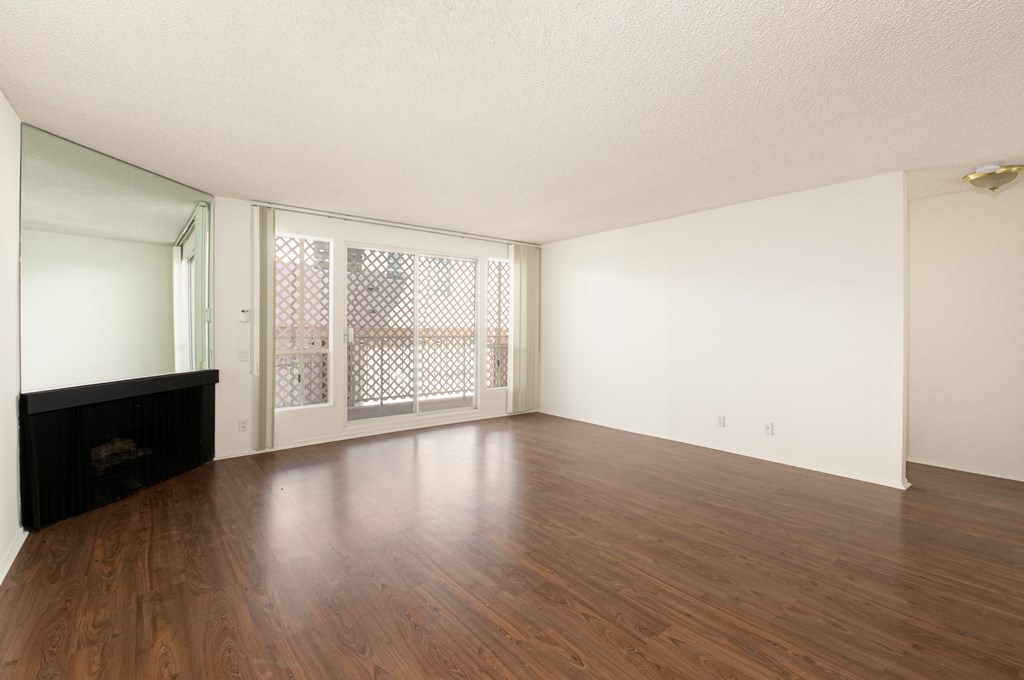 Living Room with Hardwood Floors, Fireplace and Patio Doors