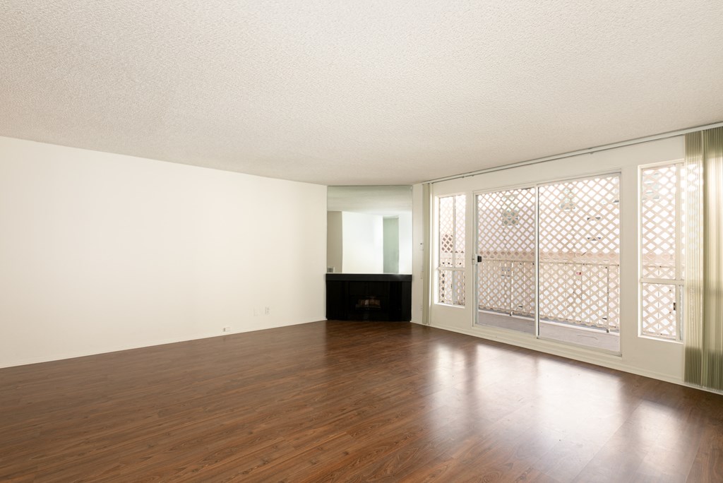 Living Room with Hardwood Floors, Fireplace and Patio Doors