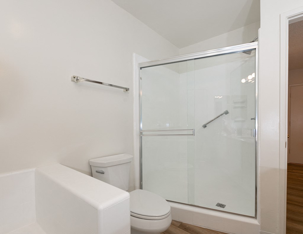 Bathroom with Shower and Hardwood Floors
