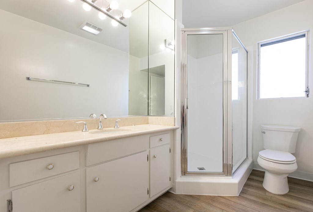 Bathroom with White Cabinets and Shower