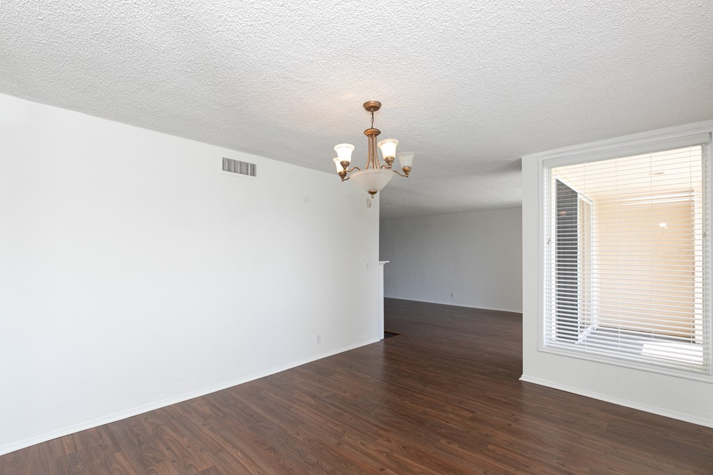 Room with Hardwood Floors and Chandelier