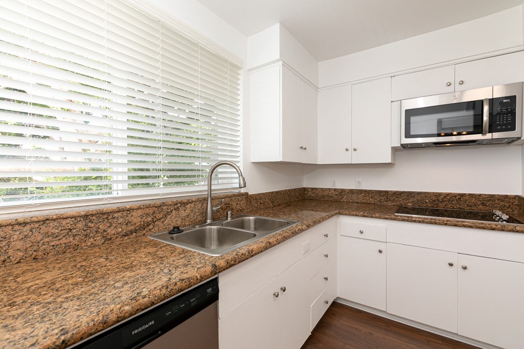 Kitchen with Stainless Steel Appliances and White Cabinets