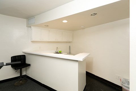 a small kitchen with a counter top and a sink