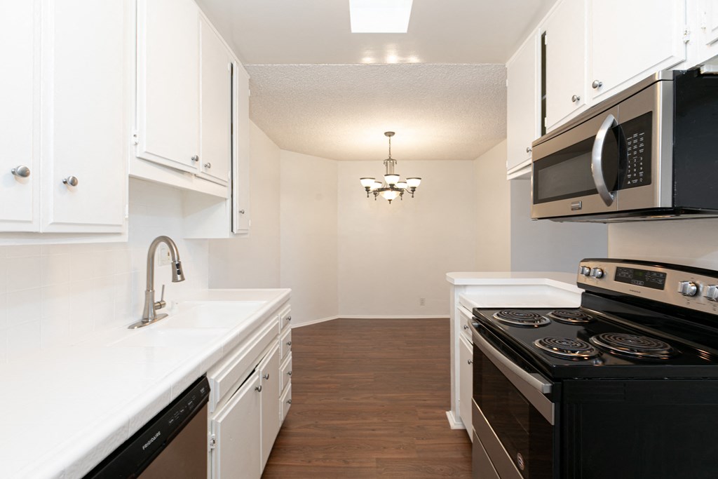 Kitchen with Stainless Steel Appliances and White Cabinets