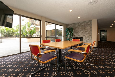 a conference room with a table and chairs