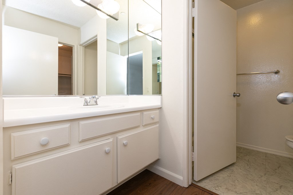 En Suite Bathroom with White Cabinets