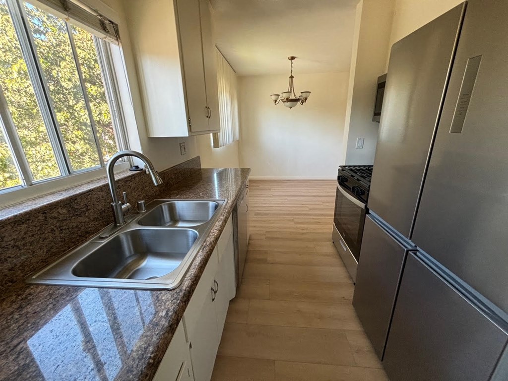 Kitchen and Dining Area with Hardwood Floors