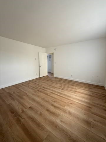 Bedroom with wood flooring