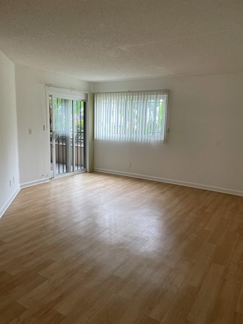 Living Room with Hardwood Floors and Patio Doors