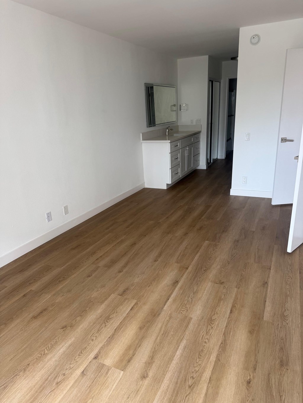 Bedroom with wood flooring