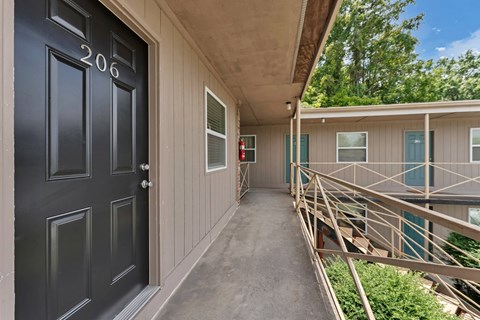 A black door with the number 206 on it.