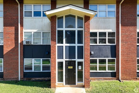 A building with a glass door and windows.