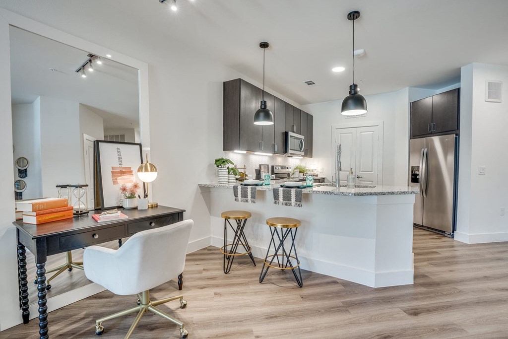 a kitchen and dining area in a 555 waverly unit at Aurora Watson Branch, Mansfield, TX, 76063