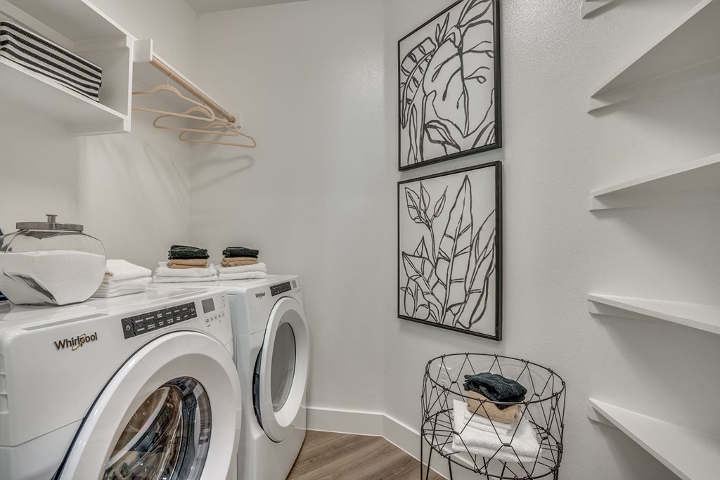 a washer and dryer in a laundry room at Aurora Watson Branch, Mansfield, Texas
