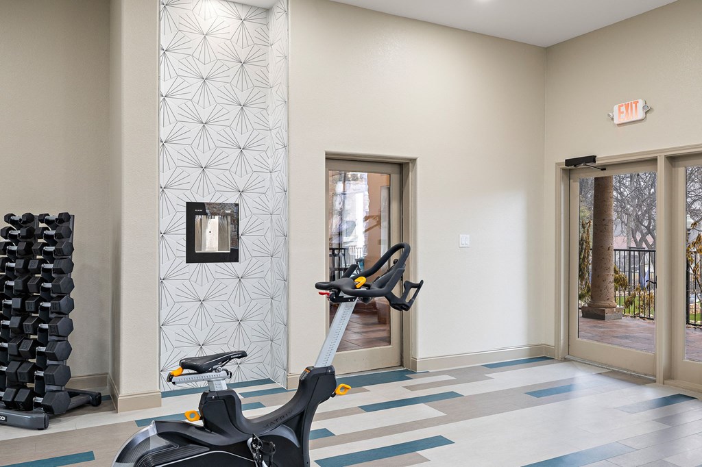 a spin bike in the fitness room at the vue at schiller park at Waters Edge Apartment Homes, Texas, 78626