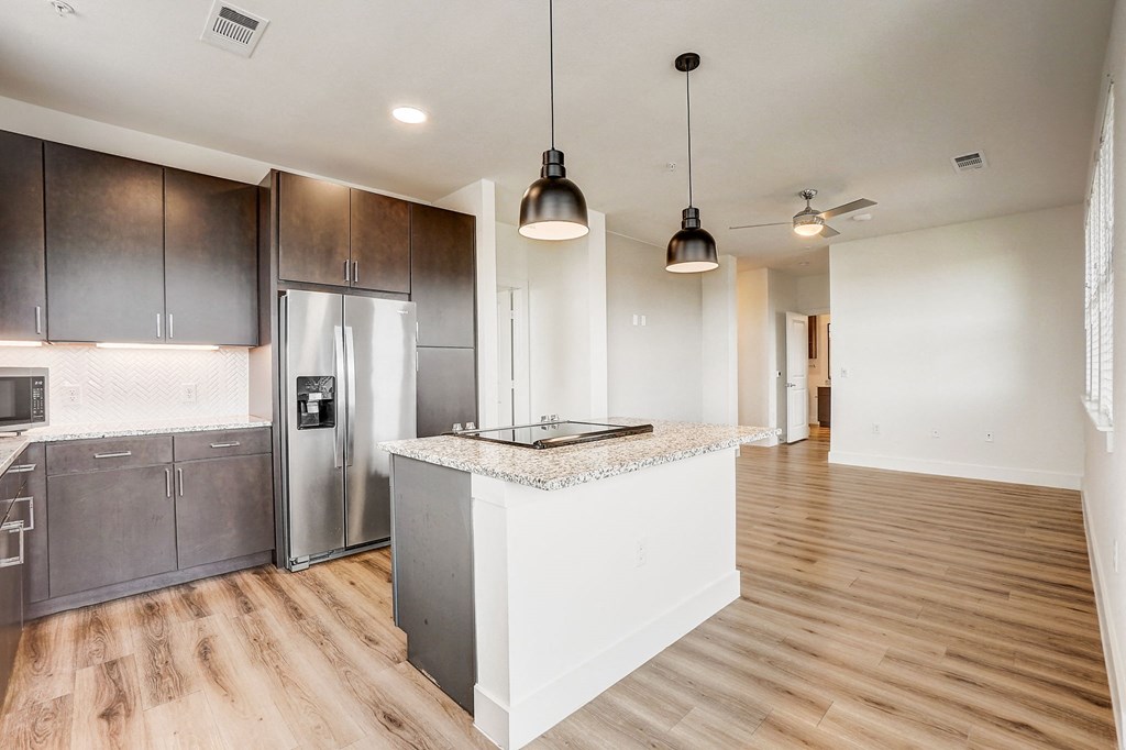 a kitchen with a island and a stainless steel refrigerator at Aurora Watson Branch, Texas, 76063