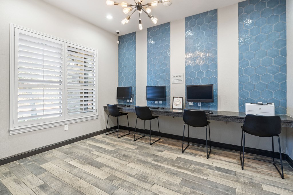 an office with three desks and three chairs and a window at Sonterra Apartment Homes, Austin, TX, 78726