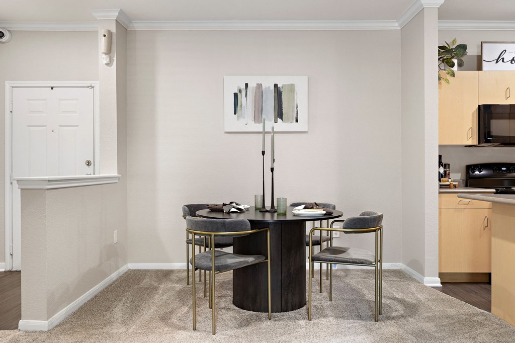 a dining room with a table and chairs at Artisan Apartments & Shops, Austin, TX
