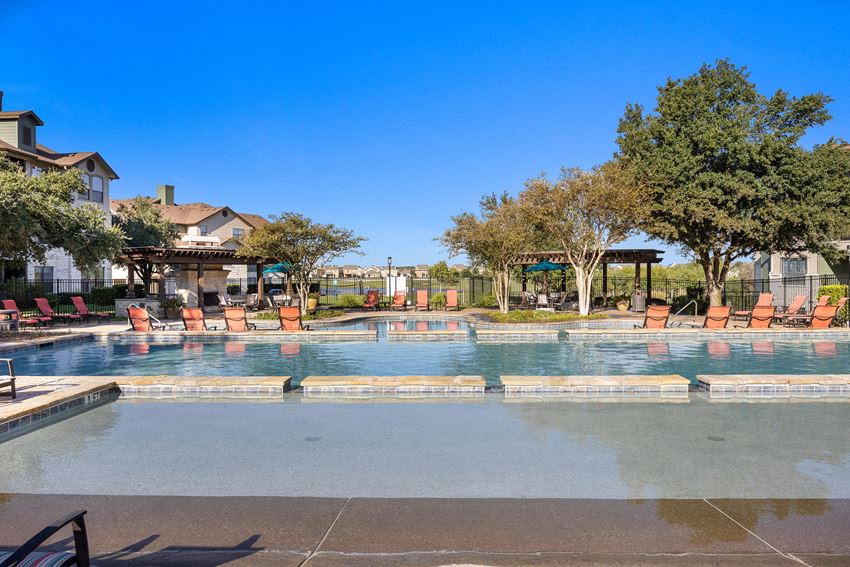 the swimming pool at the preserve at polo ridge apartments