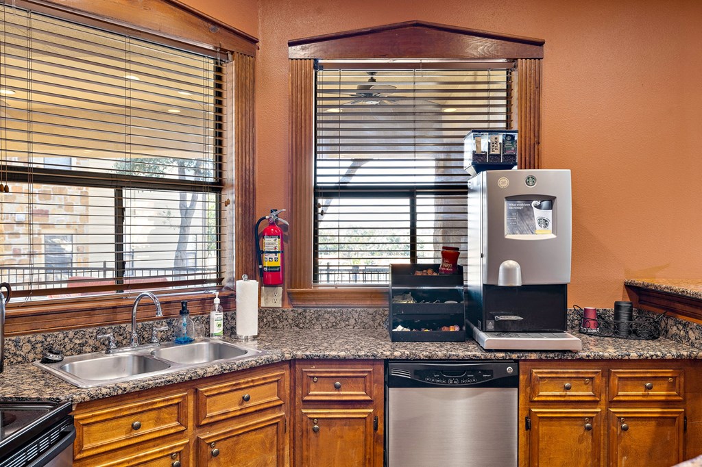 the kitchen has granite counter tops and stainless steel appliances at The Verandah, Texas