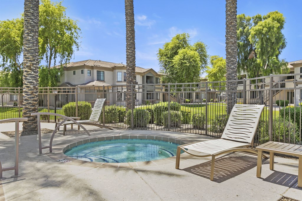 Hot tub surrounded by beautiful palm trees  at Adiamo Palm Valley, Goodyear, 85395