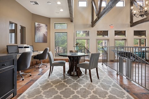 Office workspace with high ceilings and exposed beams at Waters Edge Homes Apartments, Georgetown, 78626
