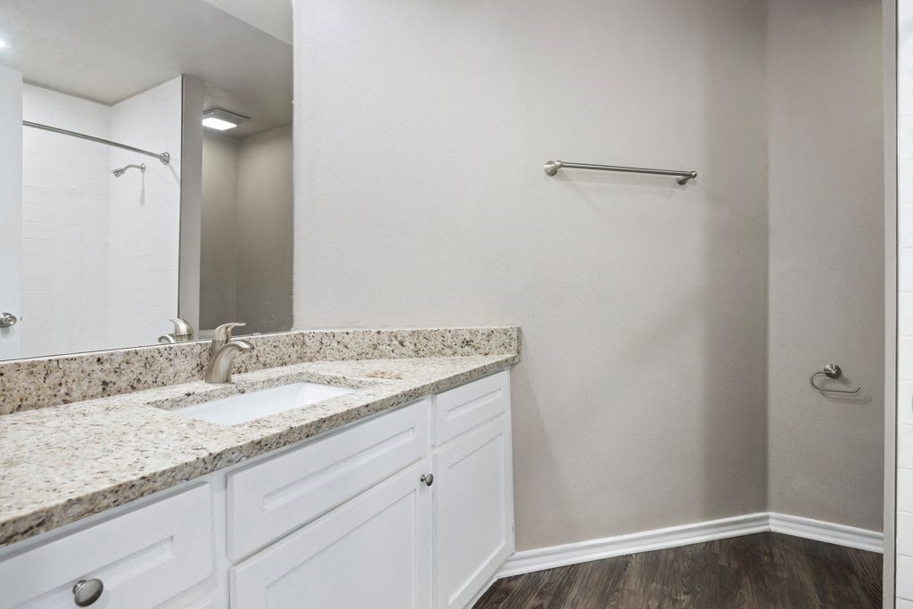 a bathroom with a sink and a mirror at Waters Edge Apartment Homes, Texas, 78626