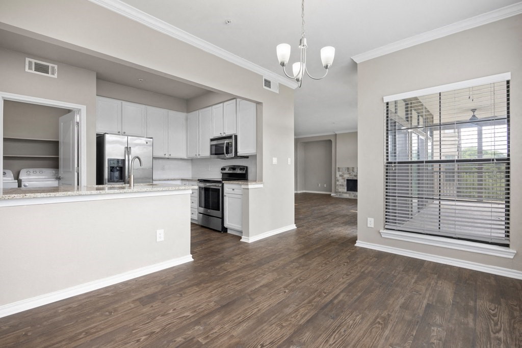 the avenues salt lake custom homes interior kitchen and living room at Waters Edge Apartment Homes, Georgetown