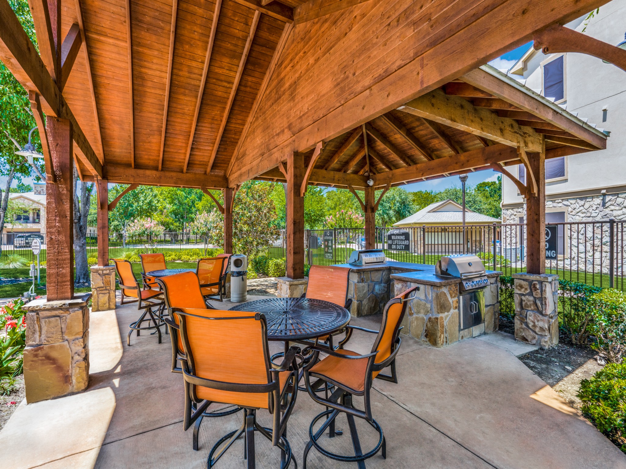 Outdoor BBQ Area and kitchen at The Canyons Apartments, Texas