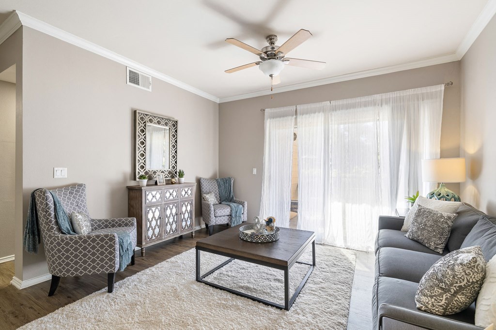 a living room with a ceiling fan at Sonterra Apartment Homes, Austin, 78726