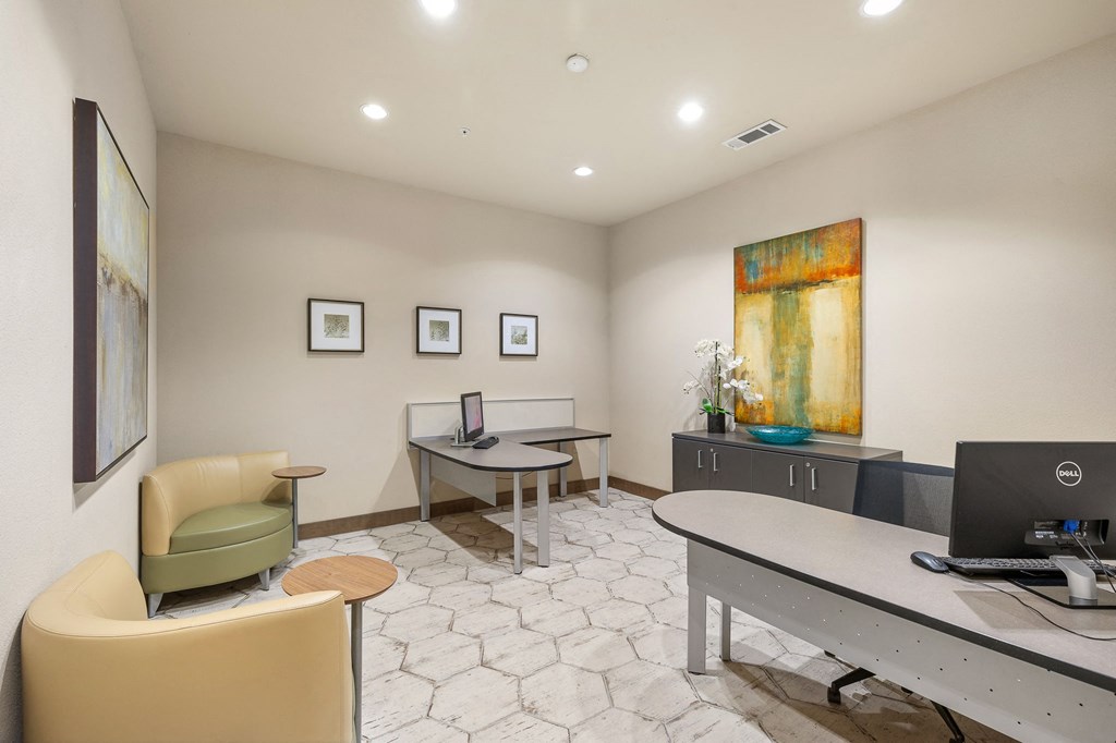 an office with a desk and chairs and a computer at Lakeline East Apartments, Texas