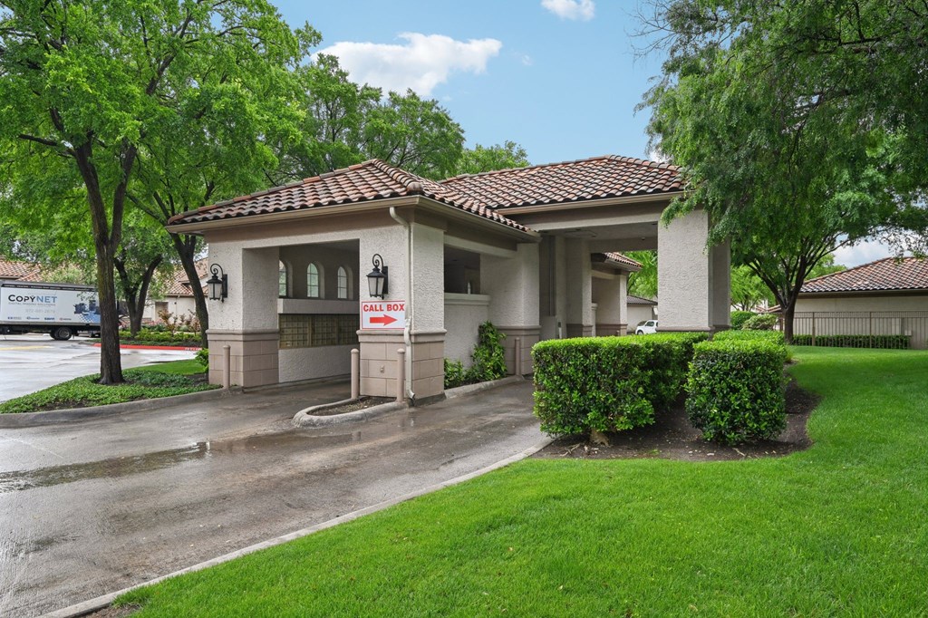 A house with a red roof and a sign that says