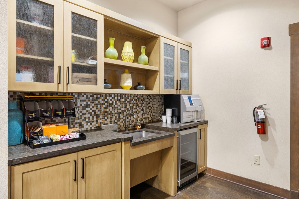a kitchen with a sink and cabinets and a fire hydrant at Lakeline East Apartments, Texas, 78613