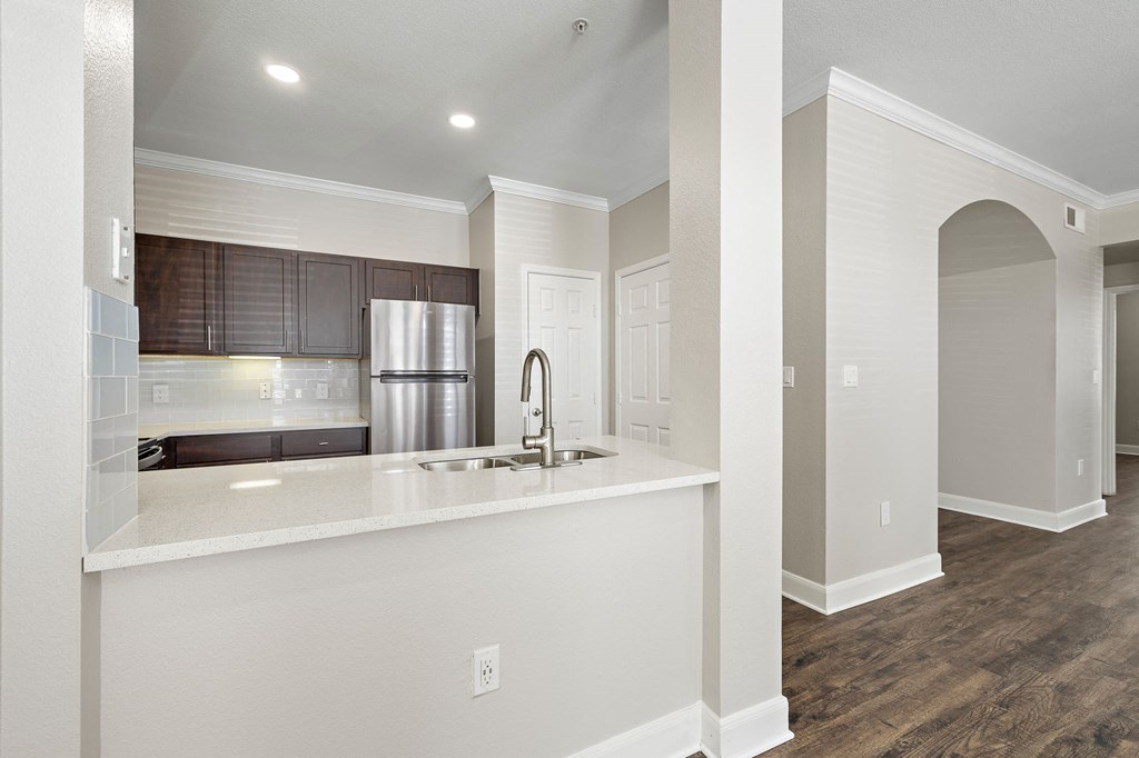 a kitchen with a large counter top and a sink at The Verandah, Austin, TX