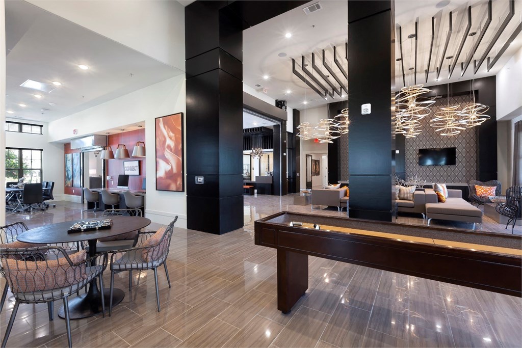 a living room with a pool table and a dining room at North Creek, Texas