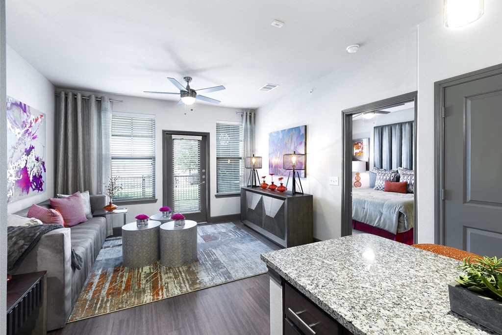 a living room with a kitchen and a bedroom at North Creek, Hutto, TX